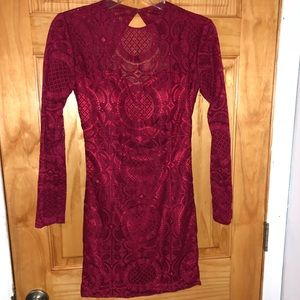 Red long sleeve open back dress